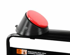 Easy mount tray with red button on black wheelchair.
