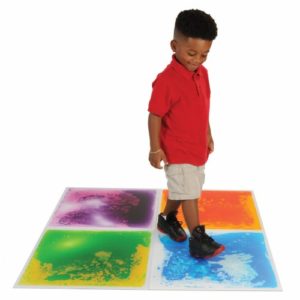 Boy Playing with Cosmic Liquid Tiles
